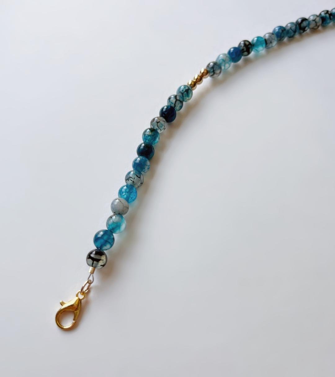 Blue Agate Dragon Vein Beaded Bracelet With Gold Clasp And Gold Trio Centerpiece Beads