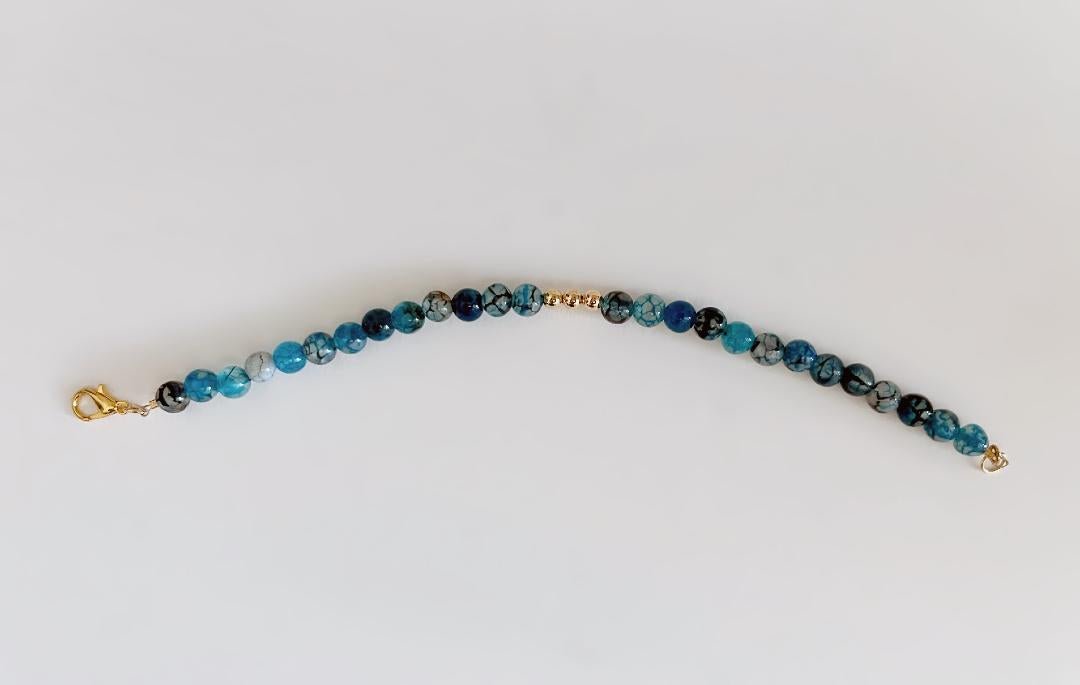 Blue Agate Dragon Vein Beaded Bracelet With Gold Clasp And Gold Trio Centerpiece Beads