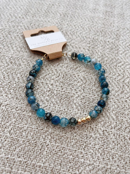 Blue Agate Dragon Vein Beaded Bracelet With Gold Clasp And Gold Trio Centerpiece Beads