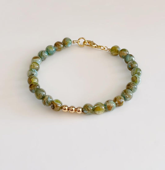 Teal and green glass beaded bracelet with gold clasp